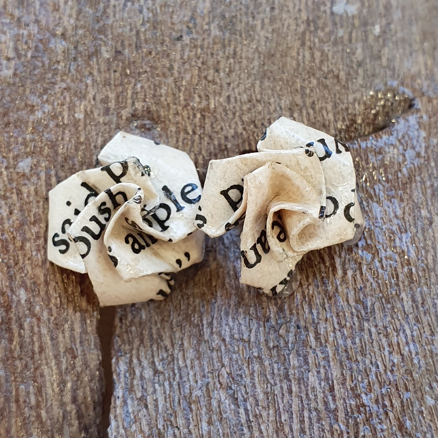 Small rose stud earrings made from an old copy of Dracula image 1