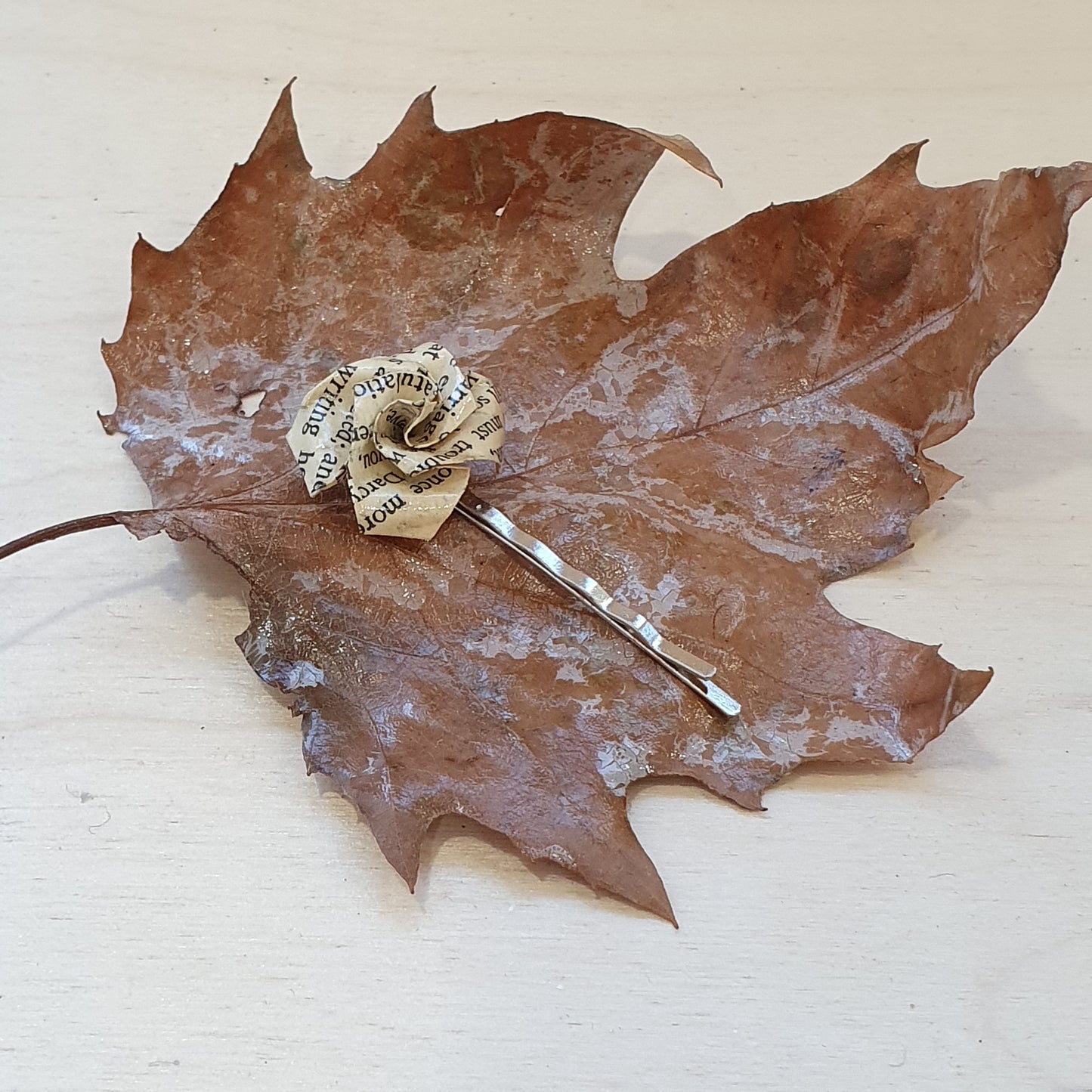 Origami rose hair grip made with paper from an old copy of Pride and Prejudice image 1